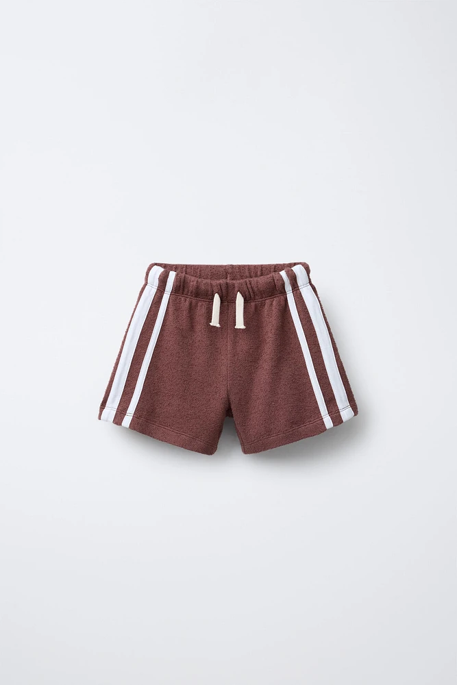 BERMUDA SERVIETTE BANDES LATÉRALES
