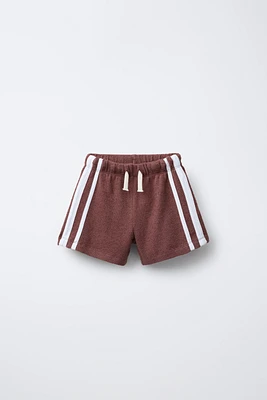 BERMUDA SERVIETTE BANDES LATÉRALES