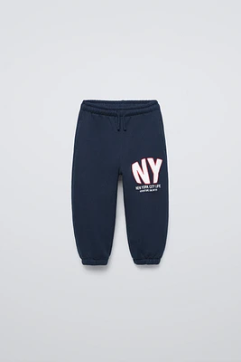 “NY” APPLE JOGGING PANTS