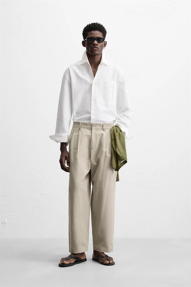 PLEATED CHINO PANTS