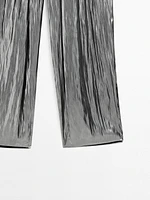 Flowing metallic trousers with gathered detail