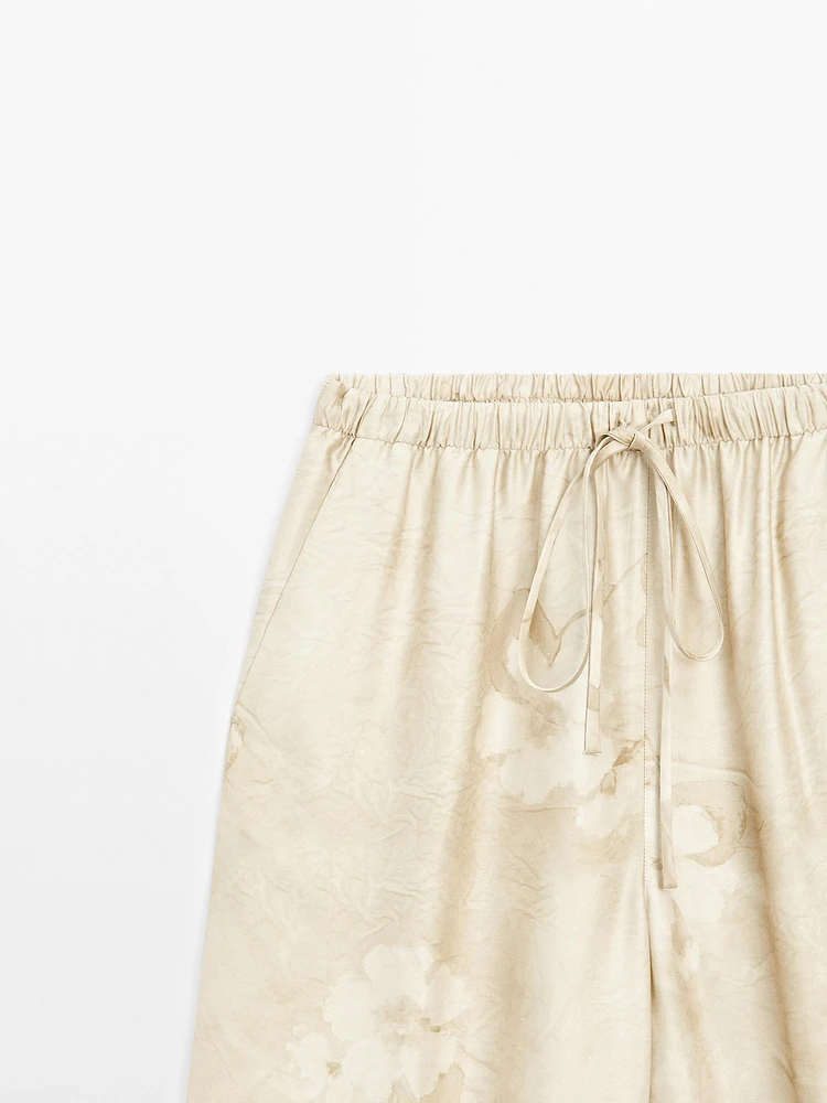 Flowing printed trousers with drawstring detail