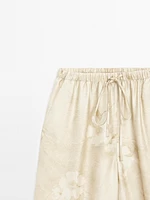 Flowing printed trousers with drawstring detail
