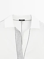 Loose-fitting blouse with contrast details