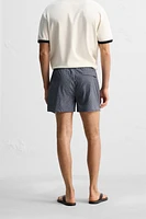 GEOMETRIC PRINT SHORT SWIMMING TRUNKS