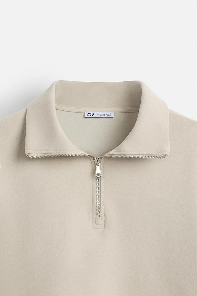 QUARTER ZIP TECHNICAL SWEATSHIRT