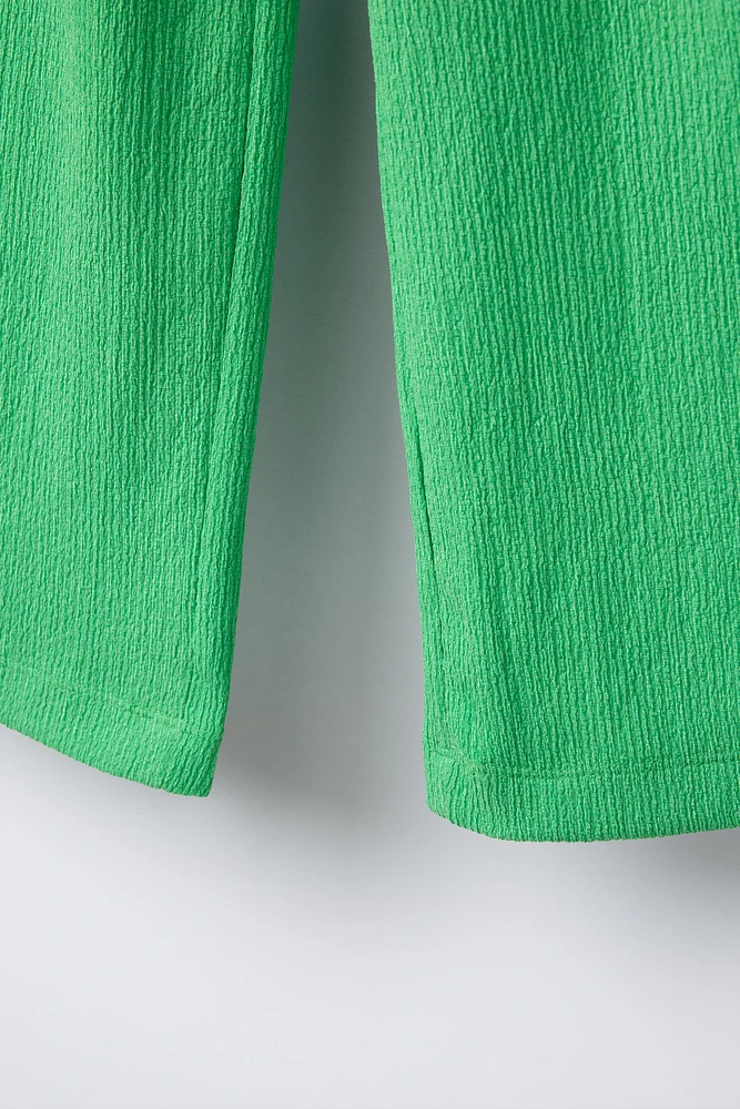 TEXTURED BELTED PANTS