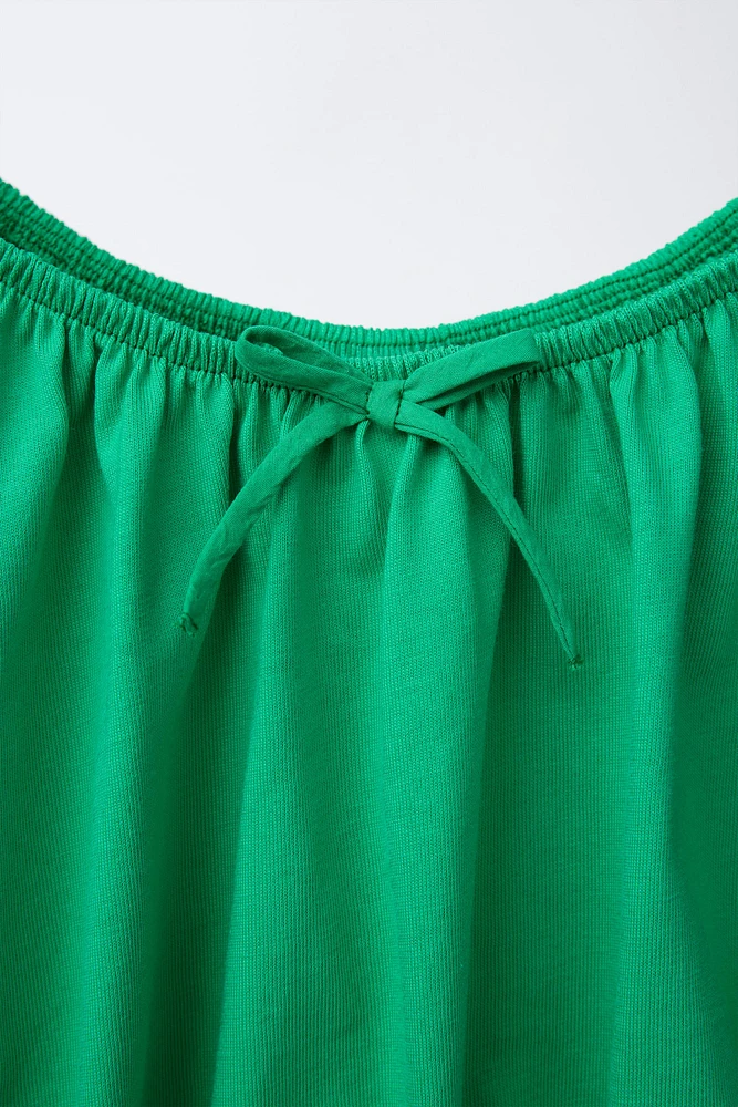 COMBINED ELASTICIZED TOP
