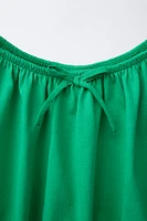 COMBINED ELASTICIZED TOP