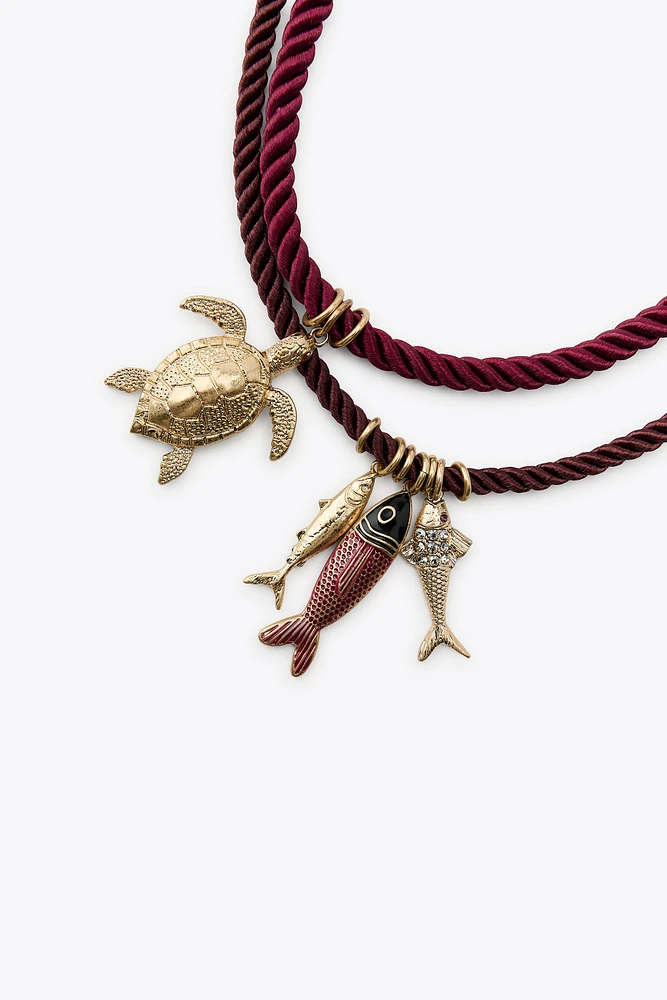PACK OF 4 ROPE NECKLACES WITH MARINE CHARMS