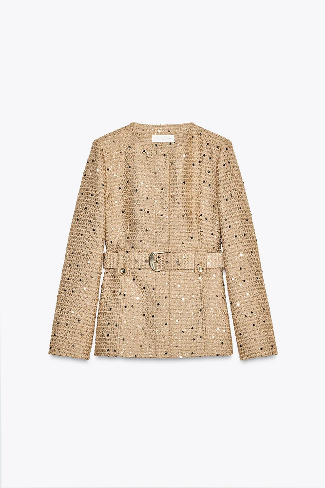 VESTE À SEQUINS ET CEINTURE