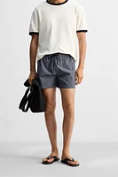 GEOMETRIC PRINT SHORT SWIMMING TRUNKS