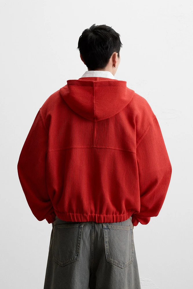 VESTE STRUCTURE OUVERTE CAPUCHE