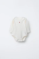 THREE-PACK OF ROUND NECK HEART BODYSUITS