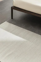 LIGHT-COLORED WOOL AREA RUG