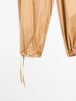 Lightweight trousers with strap details - Studio