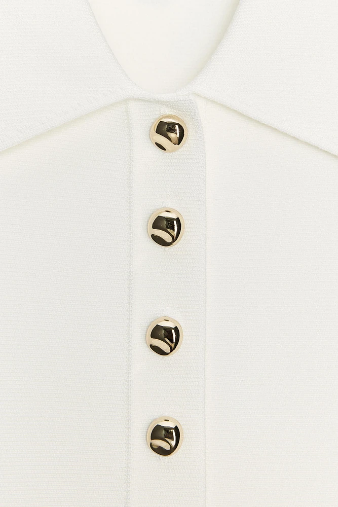 TOP GILET EN MAILLE PÉPLUM