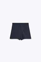 SPLIT SKIRT WITH BUTTONS