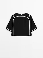 Blouse with contrast embroidery