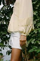 BLOUSE PLIS NERVURÉS ENTRE-DEUX