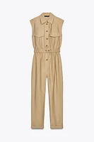 SLEEVELESS BELTED JUMPSUIT