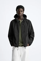 HOODED TECHNICAL JACKET