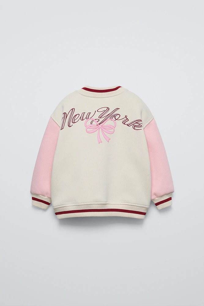 BOMBER JACKET WITH EMBROIDERED BOW