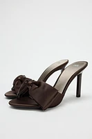 SATIN FINISH MAXI BOW HEELED SANDALS