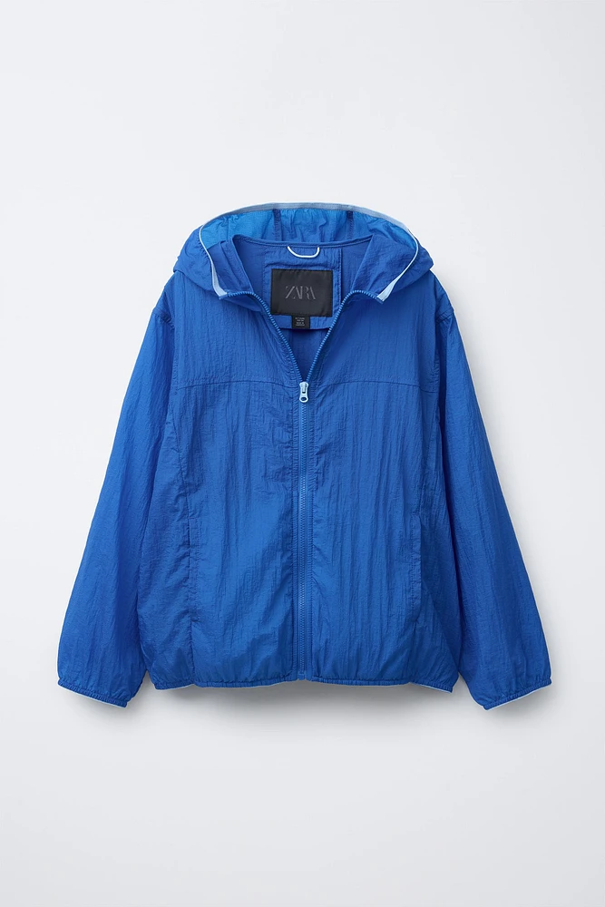 LIGHTWEIGHT PACKABLE WINDBREAKER