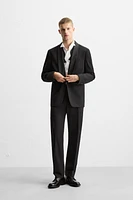 LIMITED EDITION BANDED SUIT PANTS