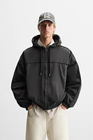 HOODED TECHNICAL JACKET