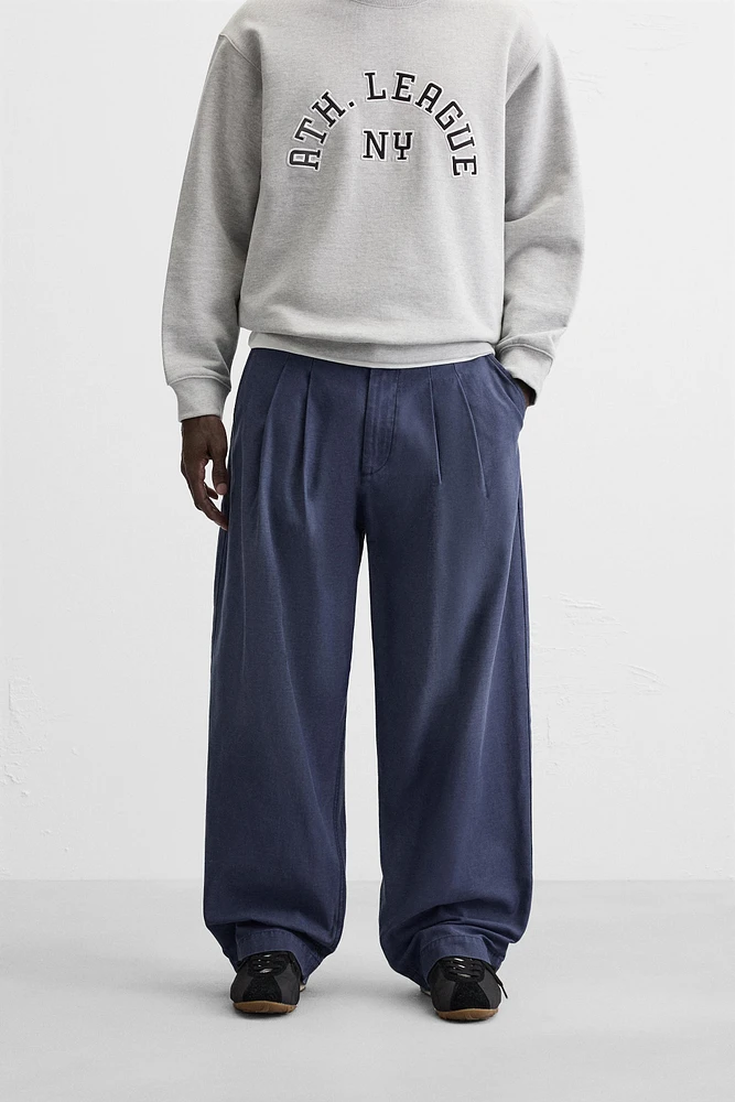 RELAXED FIT PLEATED PANTS