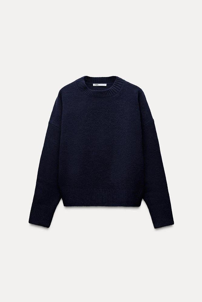 PULL DOUX EN MAILLE UNI