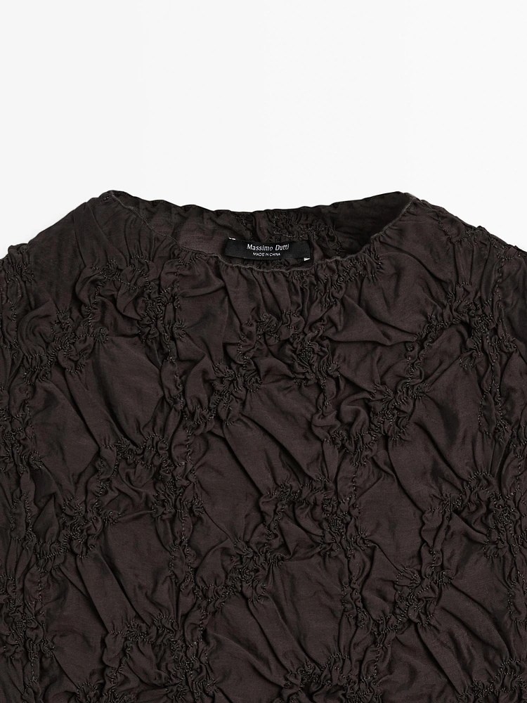 Creased-effect funnel neck top