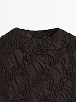 Creased-effect funnel neck top