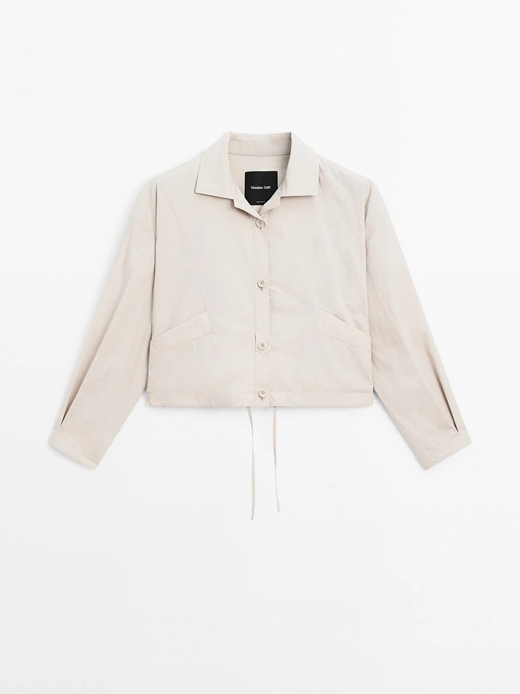 Bomber jacket with seams and gathering