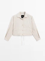 Bomber jacket with seams and gathering