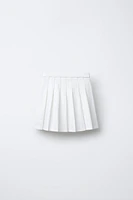 PLEATED SKIRT WITH HEART APPLIQUÉ