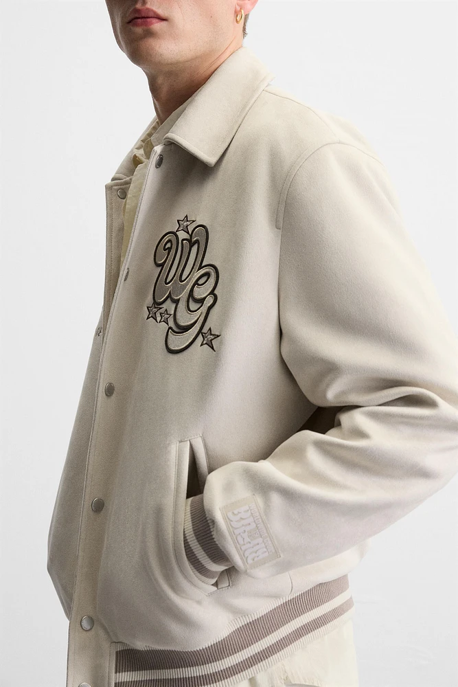 BLOUSON VARSITY EFFET DAIM AVEC PIÈCES