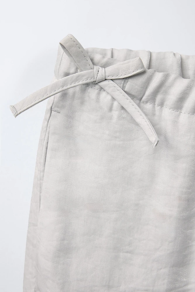 PANTALON JUPE-CULOTTE BRILLANT LACETS