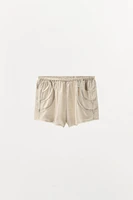 PLEATED LACE SHORTS