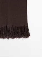 Long knit skirt with fringed hem