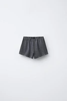 WASHED EFFECT STUDDED BERMUDA SHORTS