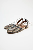 CHAUSSURES PLATES TRESSÉES
