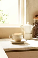PORCELAIN TEACUP WITH ANTIQUE FINISH RIM