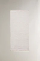 LIGHT-COLORED WOOL AREA RUG
