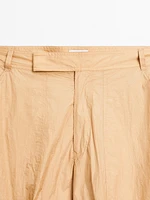 Lightweight trousers with strap details - Studio