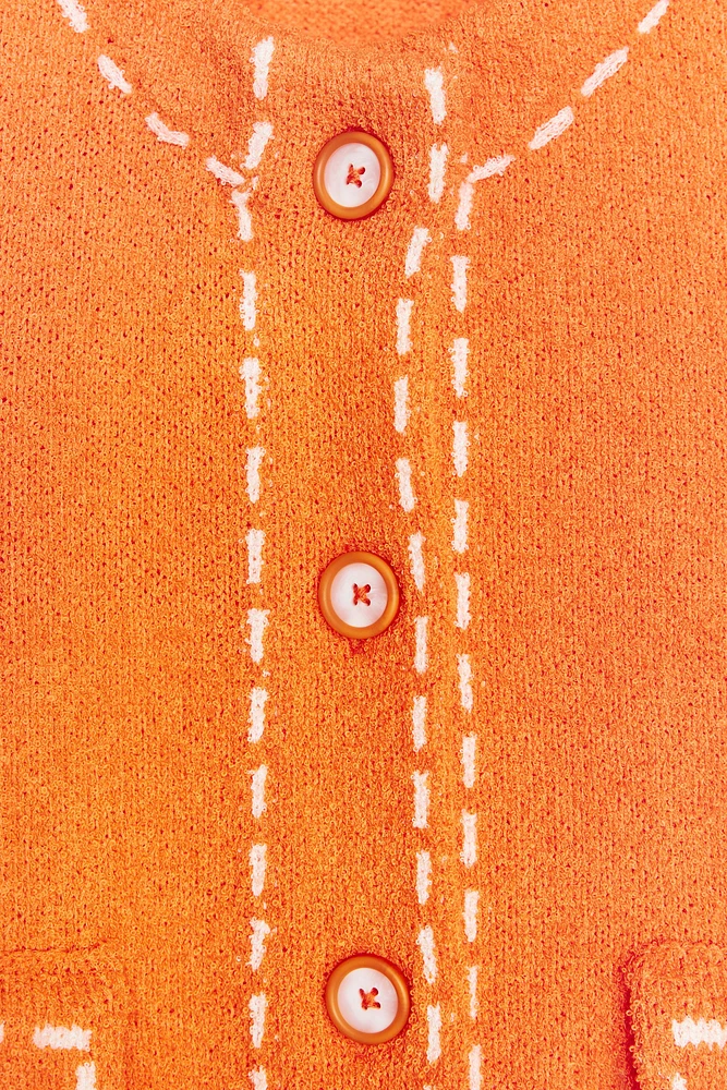 VESTE EN MAILLE SURPIQÛRES