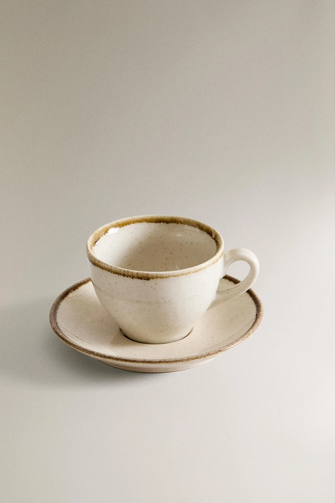 PORCELAIN TEACUP WITH ANTIQUE FINISH RIM
