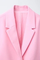 VESTE COURTE À NŒUDS
